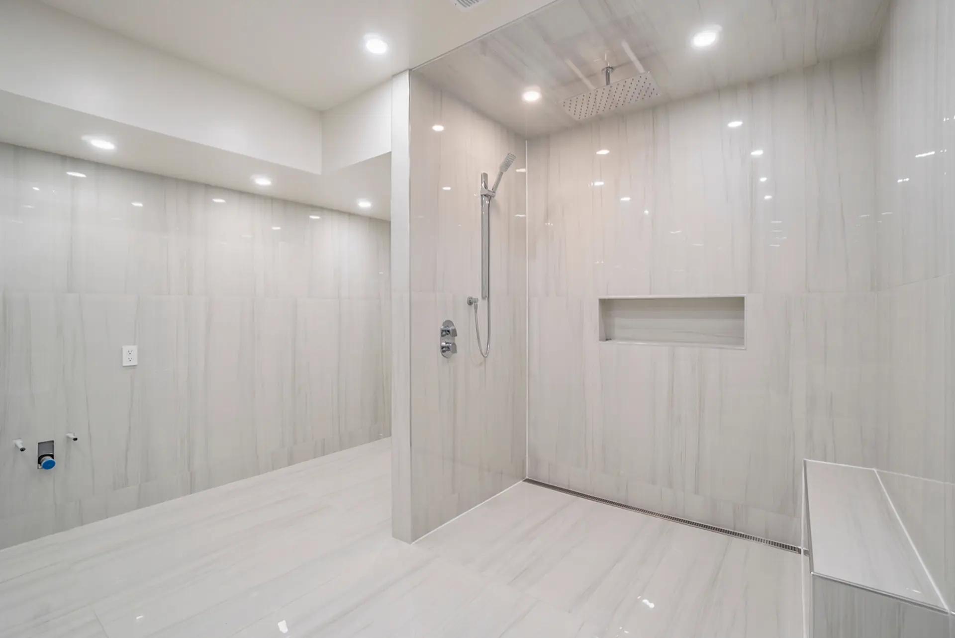 R&H custom walk-in shower with marble tile and rain head